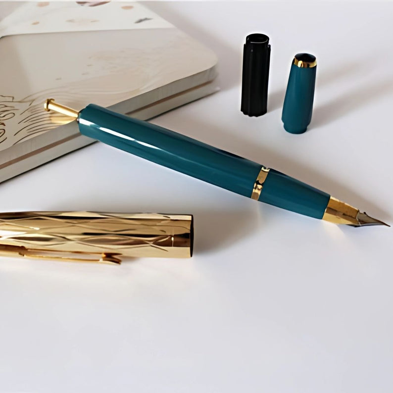 Wing Sung 601A  Blue-Green Vacumatic Fountain Pen with Golden Cap – 0.5mm Fine Nib, Ink Window Pen, Resin Body, Push-Cap with Converter & Box (No Ink)